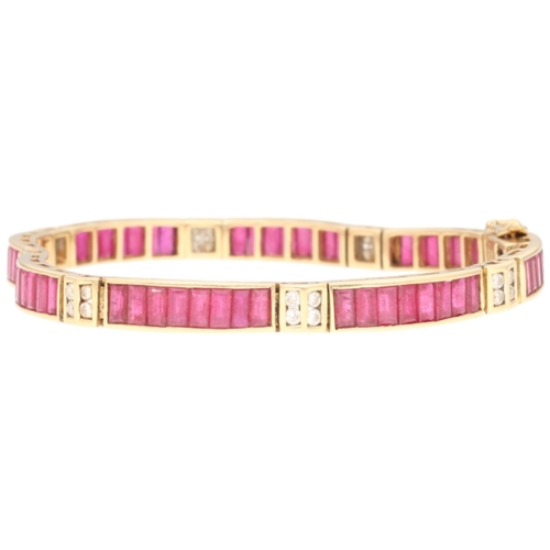 21 - A yellow metal stamped 750 ruby and diamond bracelet. Set with baguette-cut rubies and brilliant-cut... 
