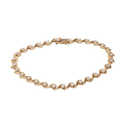 22 - A 9ct yellow gold CZ tennis bracelet. Weighing 9.4g. Wrist size: 7 inches.