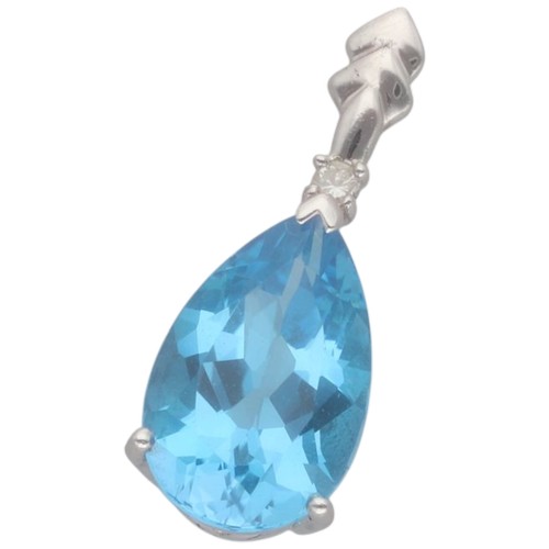 29 - A 9ct white gold topaz and diamond pendant. Set with a pear-shaped blue topaz and a brilliant-cut di... 