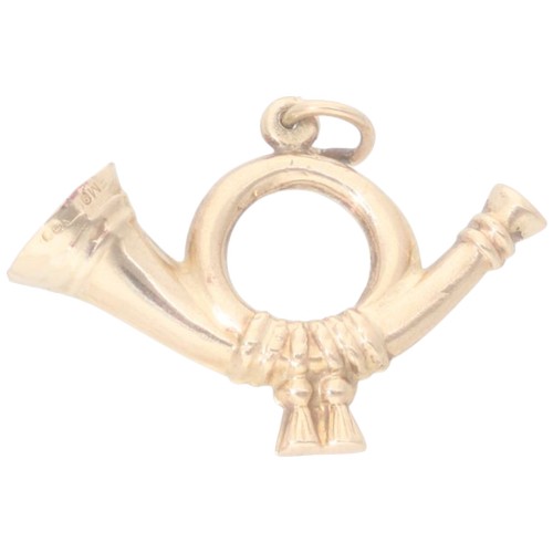 40 - A 9ct yellow gold post horn. Weighing 1.6g.