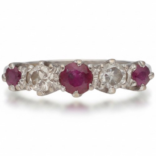 Yellow And White Metal Stamped 18ct Ruby And Diamond Ring. Set With Round Rubies And Brilliant Cut Diamonds Of 0.20ct Total Estimated Weight, Assessed As H/I Colour, SI2/I1 Clarity. Weight 2.47 Grams Finger Size J 1/2
