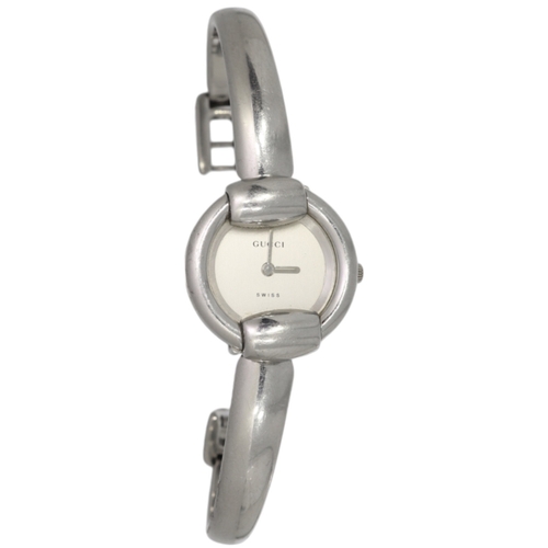 34 - Gucci 1400L

A ladies' Gucci wristwatch, reference 1400L, featuring a 25mm stainless steel case inte... 