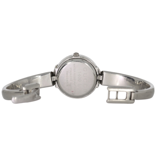 34 - Gucci 1400L

A ladies' Gucci wristwatch, reference 1400L, featuring a 25mm stainless steel case inte... 