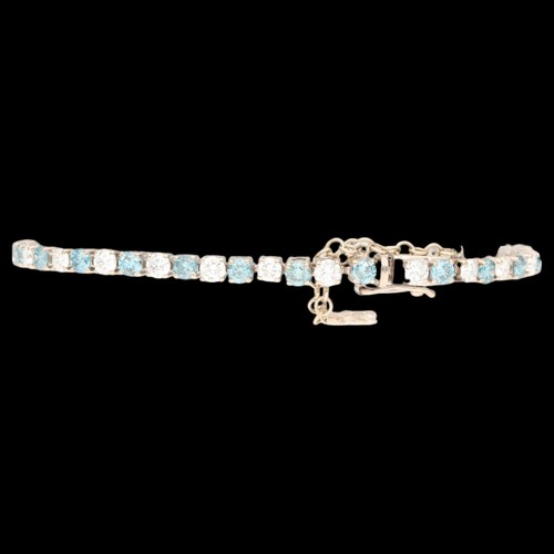 6 - White Metal Tested as 18ct Treated Blue Diamond And Diamond Tennis Bracelet. Set with treated blue b... 