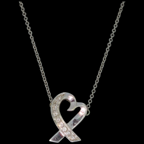 33 - 18ct white gold Tiffany diamond heart pendant and chain
Set with diamond accents
Chain length: 16 in... 