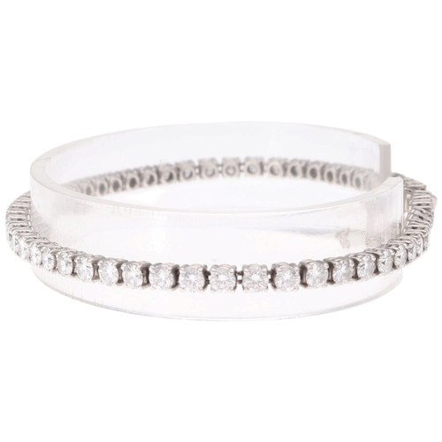 4 - A Platinum Diamond Line Bracelet. Set with brilliant-cut diamonds with a total estimated weight of 4... 