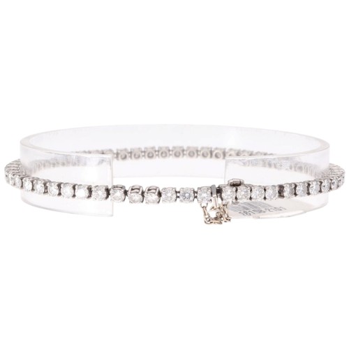 4 - A Platinum Diamond Line Bracelet. Set with brilliant-cut diamonds with a total estimated weight of 4... 