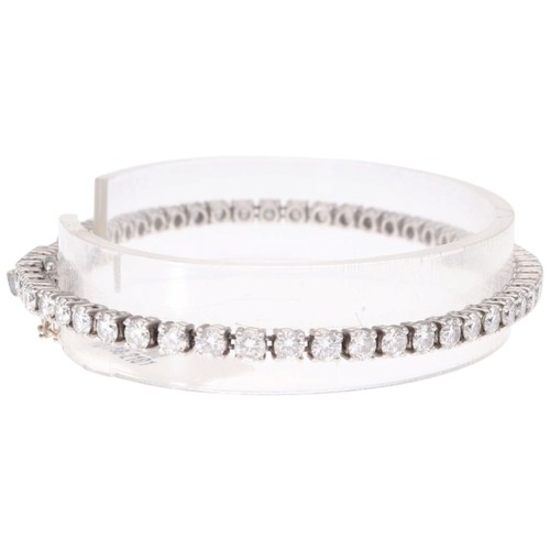 4 - A Platinum Diamond Line Bracelet. Set with brilliant-cut diamonds with a total estimated weight of 4... 