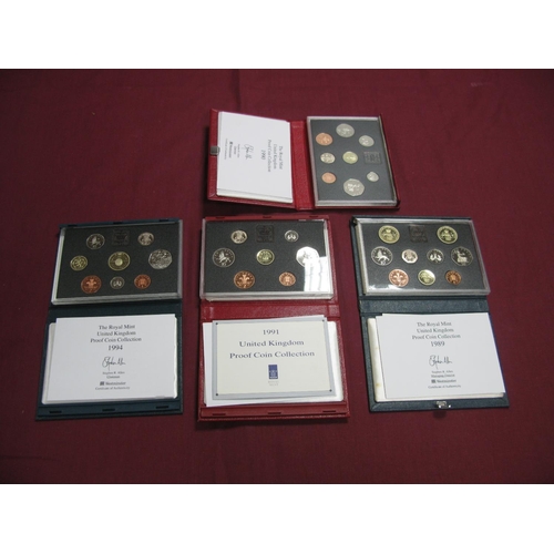 572 - Four Royal Mint United Kingdom Proof Coin Sets 1989, 1990, 1991, 1994, accompanied by literature, ca... 