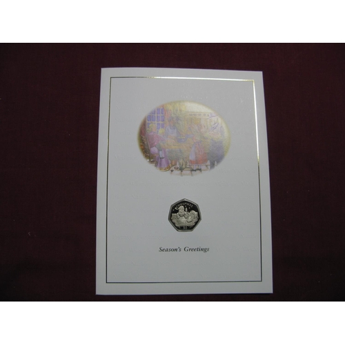 582 - A Pobjoy Mint Gibraltar Christmas Fifty Pence Coin 1998, 'Santa Chimney', carded with envelope, sell... 