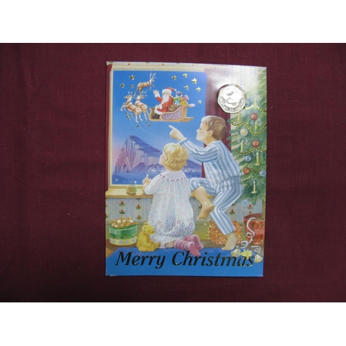 583 - A Pobjoy Mint Gibraltar Christmas Fifty Pence Coin 1997, 'Santa's Sleigh', carded (no envelope).