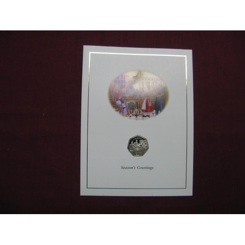 584 - A Pobjoy Mint Isle of Man Christmas Fifty Pence Coin 1998, 'Christmas Pudding', carded with envelope... 