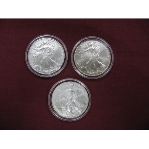 641 - Three United States of America Silver 1oz, One Dollar Coins, 2001, 2005, 2006.