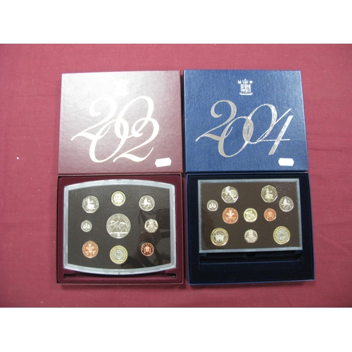 664 - The Royal Mint United Kingdom Proof Coin Collections 2002, 2004, accompanied by Westminster literatu... 