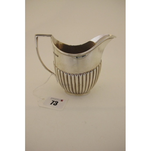 73 - A Hallmarked Silver Jug, Roberts & Belk, Sheffield 1906, of plain oval semi reeded form, with angula... 