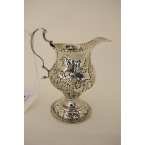 78 - A Hallmarked Silver Cream Jug, (maker's mark indistinct) London 1819, allover detailed in relief, wi... 