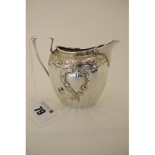 79 - A Hallmarked Silver Jug, JD&S, Sheffield 1904, of shaped oval form leaf scroll detailed in relief, w... 