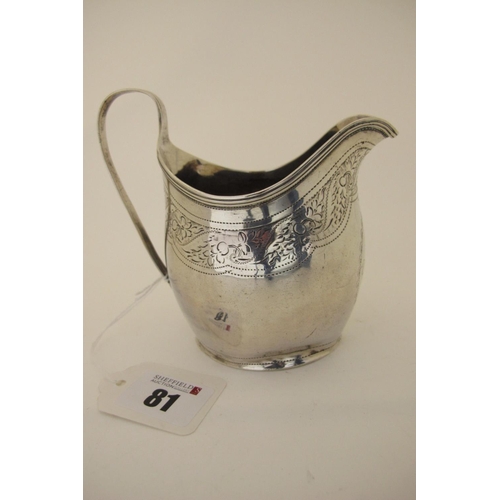 81 - A Hallmarked Silver Jug, (makers mark rubbed) possibly London 1799, foliate engraved with prick dot ... 