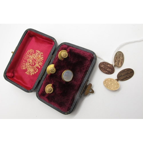 91 - A Pair of 9ct Gold Gent's Cufflinks, the oval panels with engraved decoration, on chain connections ... 