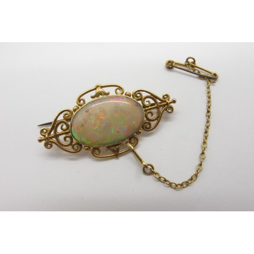 98 - A c.Early XX Century Opal Set Brooch, oval collet set to the centre with a (19mm wide) single stone ... 