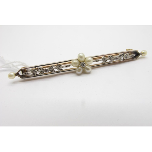 99 - An Edwardian Pearl and Diamond Set Bar Brooch, of flowerhead design to the centre, overall length 6.... 