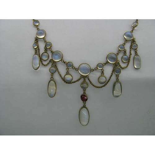 131 - An Edwardian Moonstone Festoon Style Necklace, oval and circular spectacle set, with hanging chain, ... 