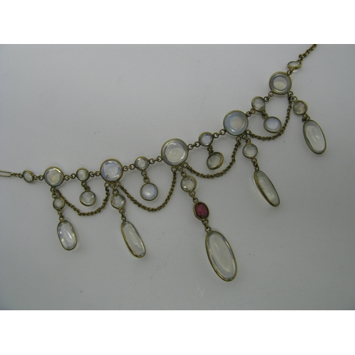 131 - An Edwardian Moonstone Festoon Style Necklace, oval and circular spectacle set, with hanging chain, ... 