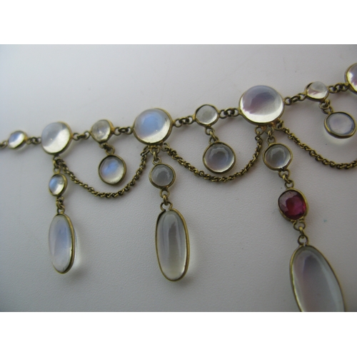 131 - An Edwardian Moonstone Festoon Style Necklace, oval and circular spectacle set, with hanging chain, ... 