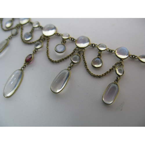 131 - An Edwardian Moonstone Festoon Style Necklace, oval and circular spectacle set, with hanging chain, ... 