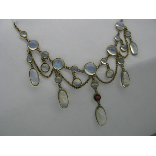 131 - An Edwardian Moonstone Festoon Style Necklace, oval and circular spectacle set, with hanging chain, ... 