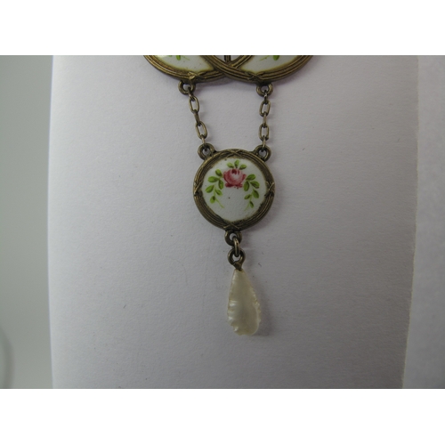 113 - An Early XX Century Gilt and Enamel Pendant, oval collet set to the centre, highlighted in pink and ... 