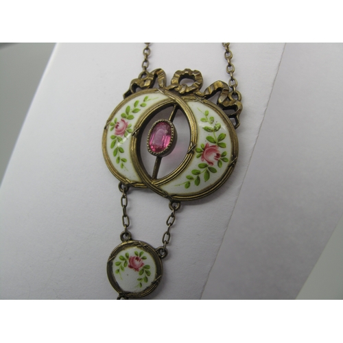 113 - An Early XX Century Gilt and Enamel Pendant, oval collet set to the centre, highlighted in pink and ... 
