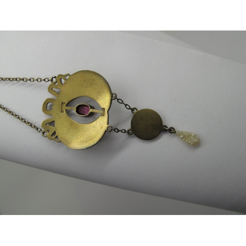 113 - An Early XX Century Gilt and Enamel Pendant, oval collet set to the centre, highlighted in pink and ... 