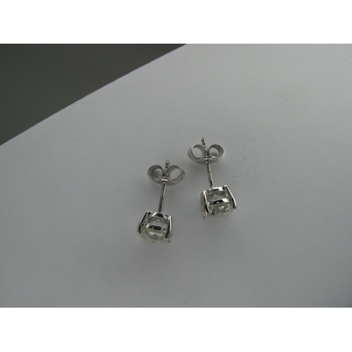 145 - A Pair of Large 18ct White Gold Single Stone Diamond Earstuds, each (6mm) brilliant cut stone four c... 