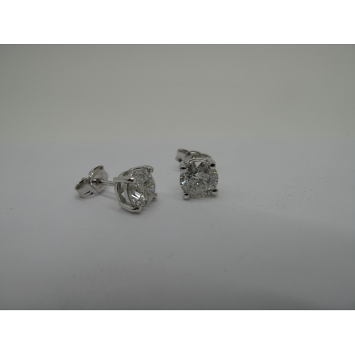 145 - A Pair of Large 18ct White Gold Single Stone Diamond Earstuds, each (6mm) brilliant cut stone four c... 