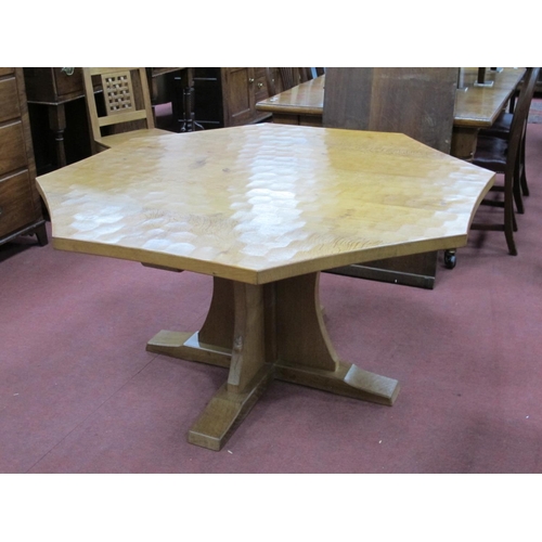 809 - A Robert Thompson (Mouseman) Oak Octagonal Dining Table, raised on a cross base, carved mouse signat... 