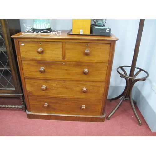 1592 - A XIX Century Mahogany Chest, of two small and three long graduated drawers, having turned knobs and... 