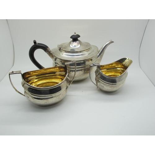 85 - A Hallmarked Silver Three Piece Tea Set, Manoah Rhodes, London 1916, each of oval form with reeded e... 