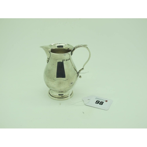 98 - A Hallmarked Silver Cream Jug, SLd, Birmingham 1939, of plain baluster form, on circular spreading b... 