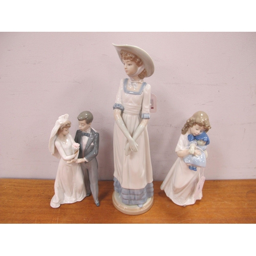 1231 - Lladro Figurine Group of A Married Couple, together with two others.