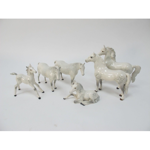 1285 - Four Beswick Pottery Horses and Foal, all in grey with oval backstamp, a similar seated foal with im... 