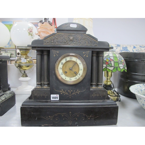 1409 - XIX Century Prints, black slate mantle clock with circular dial, Arabic numerals, column supports.