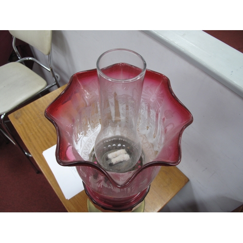 1402 - A Brass Oil Lamp, circa 1900 with eighteen facets to cranberry glass well, etched and tinted shade.