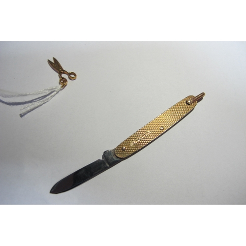 342 - A Pocket Knife, 9ct gold, London 1950, with single blade and lanyard ring, 5cm closed and a pair of ... 