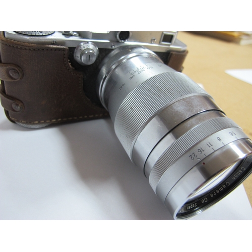 790 - Canon No. 22574, in camera holder, Canon No. 22547, in leather case, Canon Lens 135mm No. 61108, Can... 