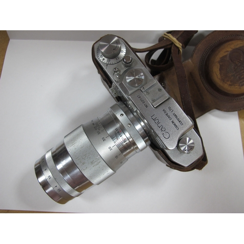 790 - Canon No. 22574, in camera holder, Canon No. 22547, in leather case, Canon Lens 135mm No. 61108, Can... 