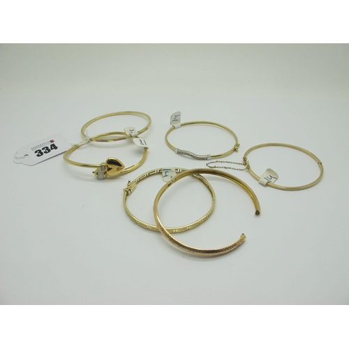 334 - A Modern Bangle, of crossover design, with heart and bead detail, stamped 