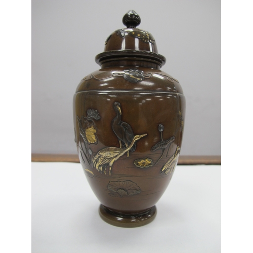 1083 - A Late XIX Century Japanese Bronze Vase and Cover, of hexagonal form overlaid with cranes in shallow... 