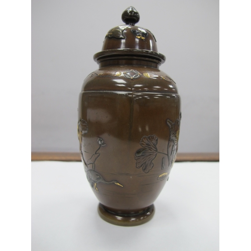 1083 - A Late XIX Century Japanese Bronze Vase and Cover, of hexagonal form overlaid with cranes in shallow... 