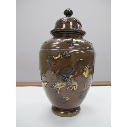 1083 - A Late XIX Century Japanese Bronze Vase and Cover, of hexagonal form overlaid with cranes in shallow... 